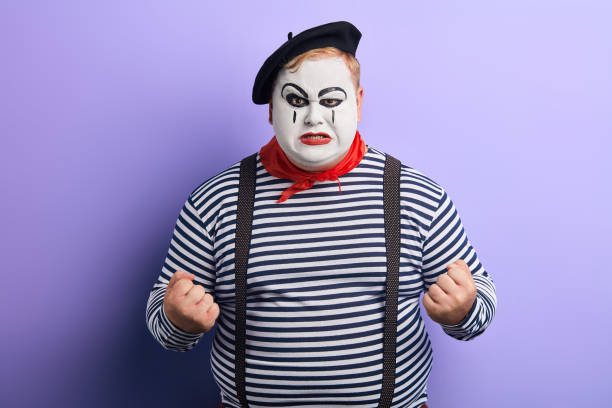 istock Mime man with clenched fists looking angry at camera 1227292257