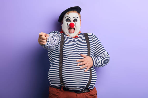 istock funny crazy fat artist touching his stomach, laughing 1227292320