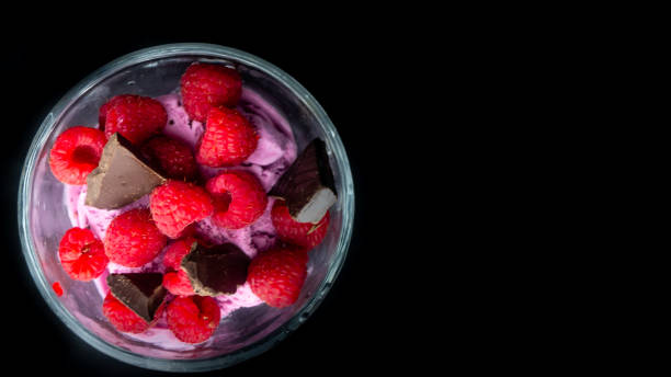 Cup with raspberry ice cream and chocolate.