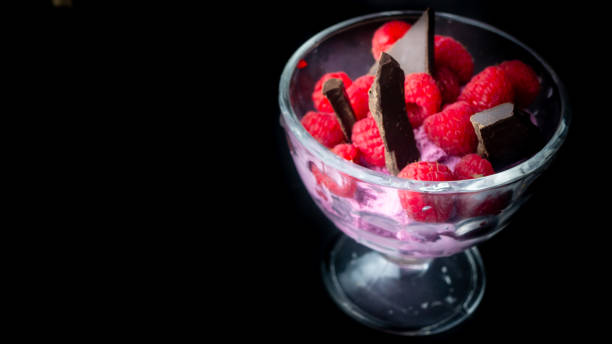 Cup with raspberry ice cream and chocolate.
