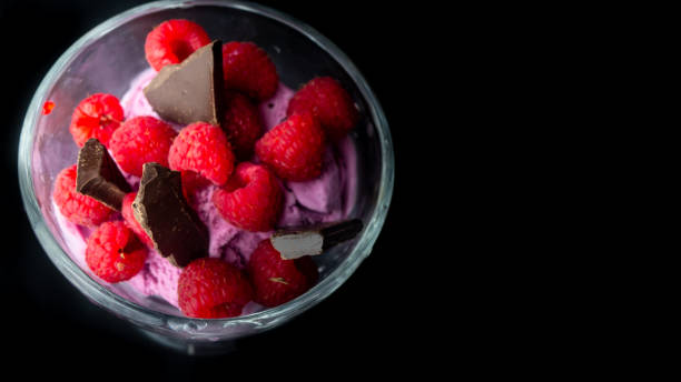 Cup with raspberry ice cream and chocolate.