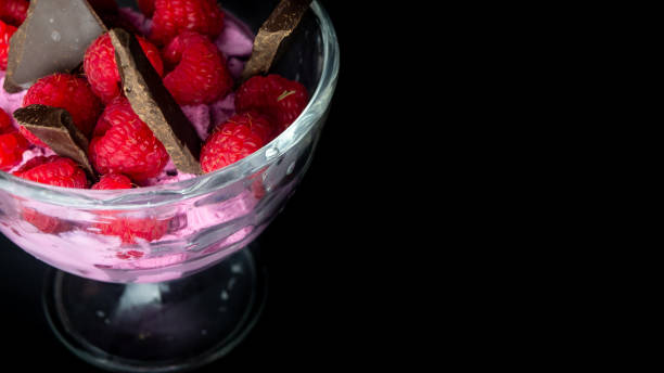 Cup with raspberry ice cream and chocolate.