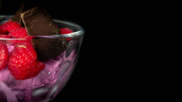 Cup with raspberry ice cream and chocolate.