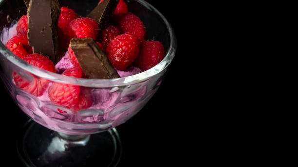 Cup with raspberry ice cream and chocolate.