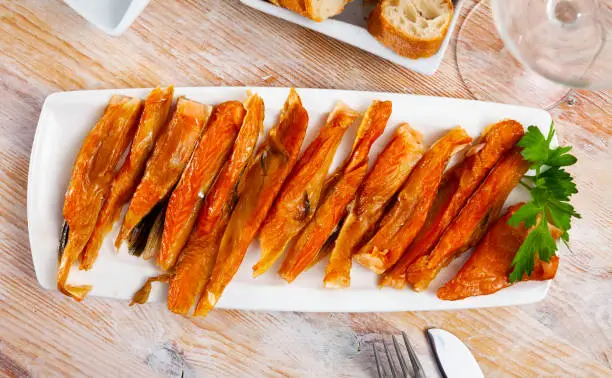 Photo of Smoked salmon belly strips with parsley