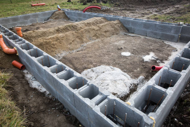 istock Foundations of the house, unfinished bungalow, rough construction 1227300421