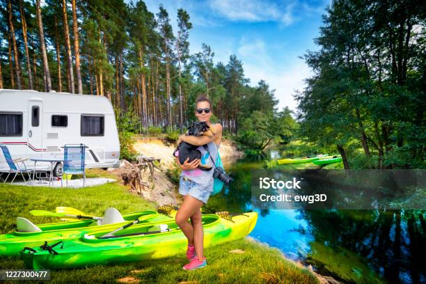 Summer Holiday With A Canoe In Poland Stock Photo - Download Image Now - Kayaking, Dog, Motor Home