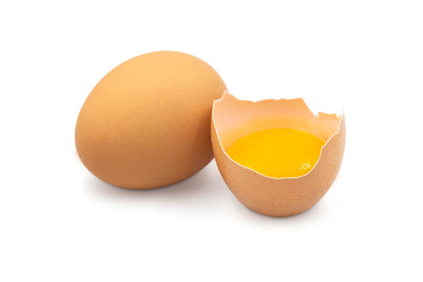 istock Fresh organic uncooked whole chicken egg and in half broken shell on white isolated background with clipping path, studio perfect shot. Egg is high protein food and good for health. Raw food concept. 1227301219