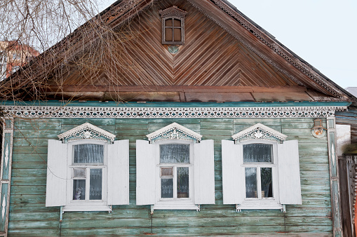 Old Russian wooden house in the city of Astrakhan, the times of the former Russian Empire. The house is located in the northern part of the city of Astrakhan (beyond the Kutum River), and the entire area is subject to demolition, with subsequent construction, which is already under way. The historical appearance of the old city is changing rapidly.