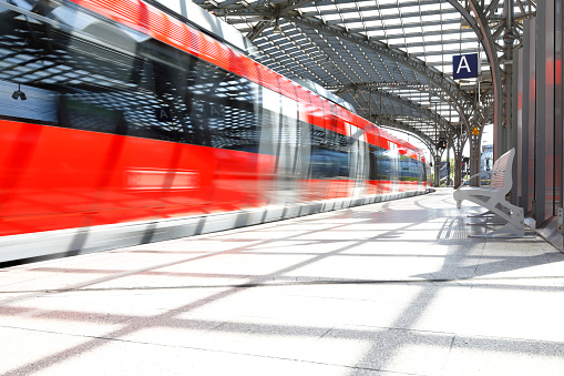Red regional train (slow train) enters Cologne Main Railway Station