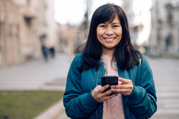 istock Portrait of a happy Asian using smartphone 1227307043