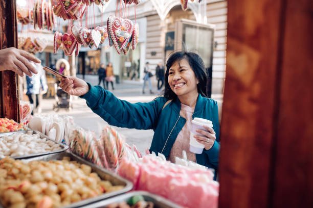 istock Asian tourist paying for candies 1227307068