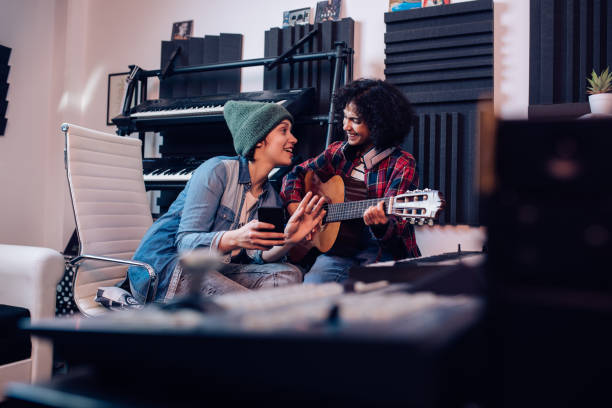 istock Two female musicians playing and singing in the studio 1227307099