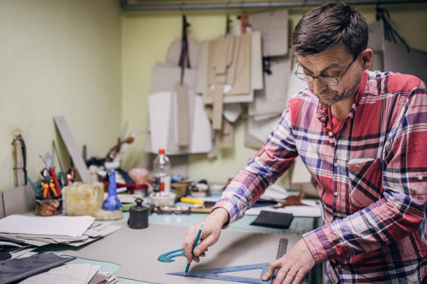 istock Mature man making measurements for female purse 1227307254