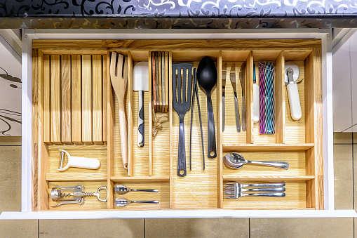 Opened kitchen drawer , a smart solution for kitchen storage and organizing.