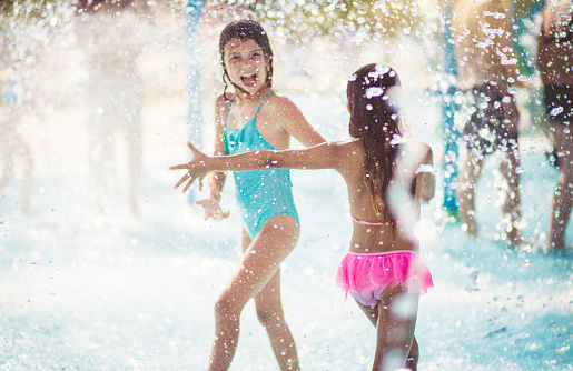 Summer makes us happy. Children having fun in the pool.
