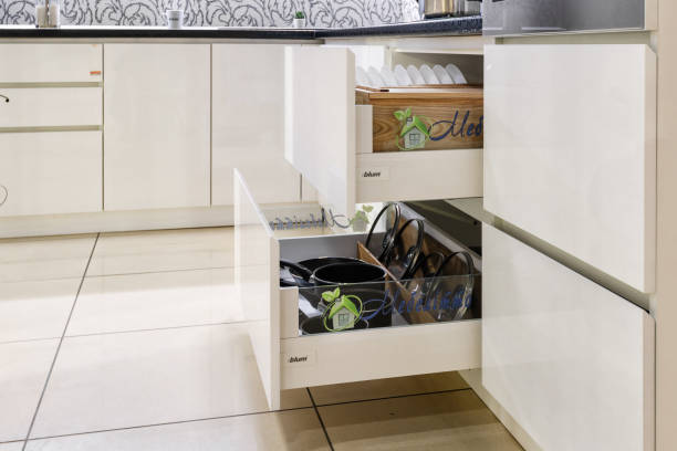 istock Opened kitchen drawer, kitchen in a traditional style with wooden white facade 1227308591