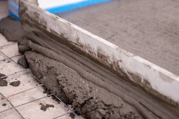 istock Builder worker plastering concrete at floor of house construction 1227309211