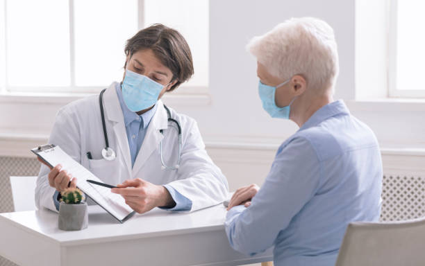 istock General practitioner showing analysis results to senior woman 1227309963