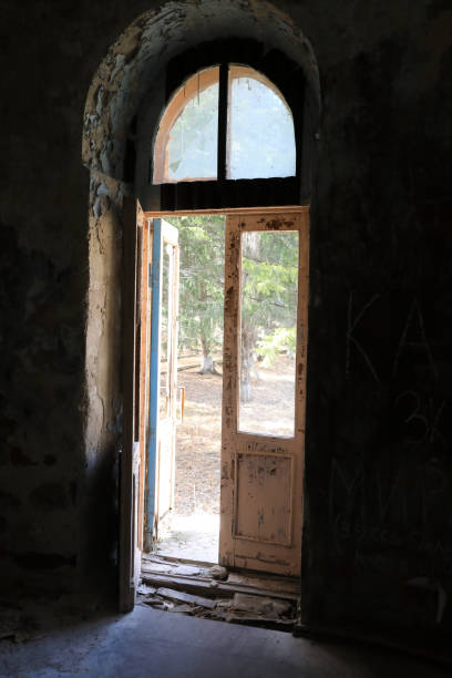 istock Open broken door of building 1227311829