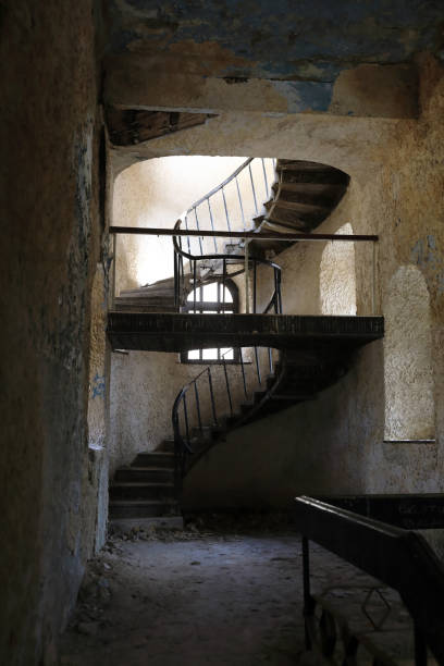 istock Spiral staircase in abandoned building 1227311846