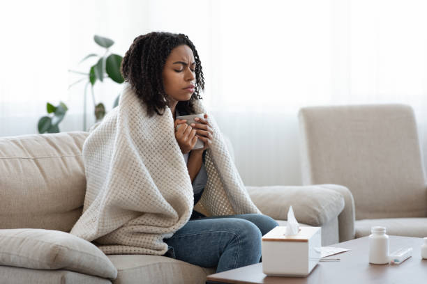 istock Sick Black Woman Suffering From Flu At Home, Drinking Tea And Resting 1227312906