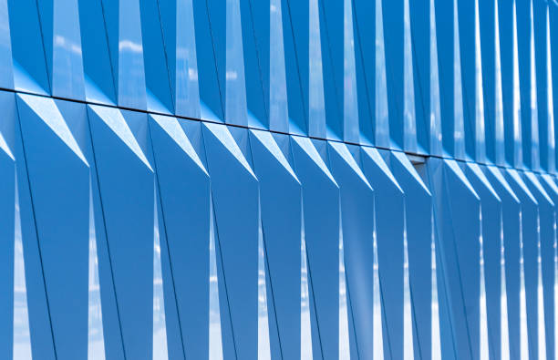 istock Low Angle View Of Modern Building Against Blue Sky 1227313061