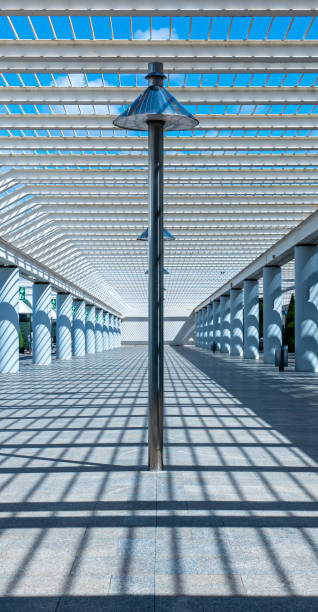 istock Low Angle View Of Modern Arcade With Light And Shadow 1227313128