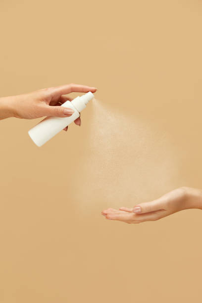 istock Antibacterial Spray. Female Hands Applying Sanitizer On Beige Background. Daily Routine With Antiseptic Products For Virus Prevention And Staying Healthy. 1227313661