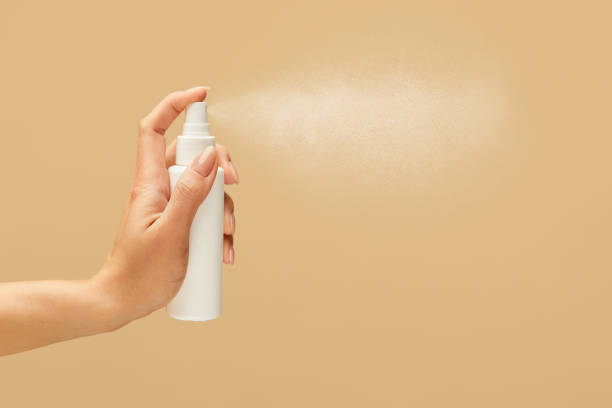 istock Hygiene. Hand Spraying Antiseptic On Beige Background. Using Sanitizer For Virus Prevention And Staying Healthy. 1227313878