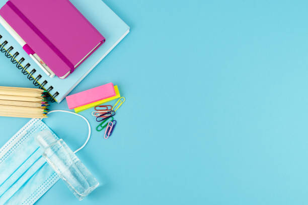 istock Useful for the return to school and mask on a blue background. Copy space. Concept return to the studio. 1227315465