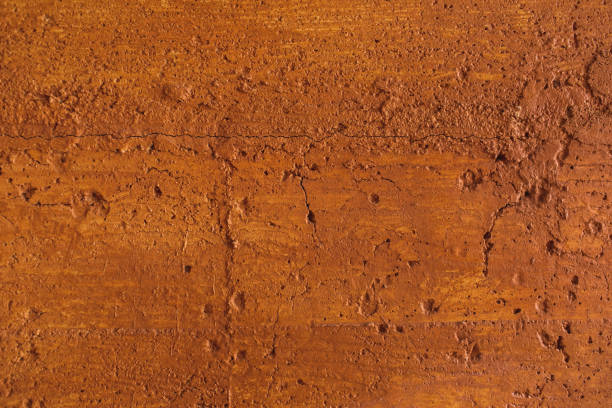 istock Traditional moroccan terracotta colored background. Orange or ocher clay wall texture. Painted shabby concrete. 1227316396