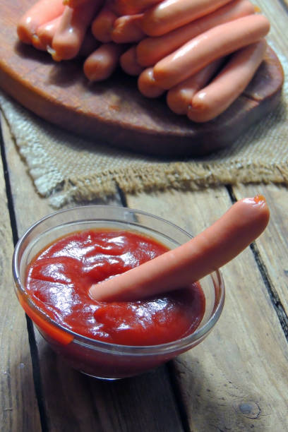 istock sausages and sauce 1227318828