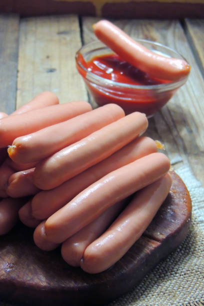 istock sausages and sauce 1227318863