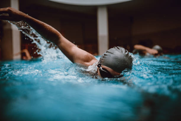 swimming race for friends - gym women inside of exercising imagens e fotografias de stock