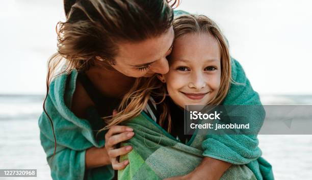 Mom And Daughter At The Beach Stock Photo - Download Image Now - Mother, Family, Child