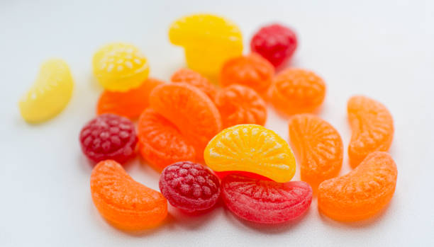 istock little fruit colored sweet lollipops isolated on white background 1227321614