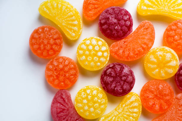 istock little fruit colored sweet lollipops isolated on white background 1227321631