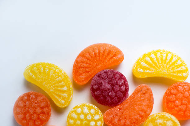 istock little fruit colored sweet lollipops isolated on white background 1227321647