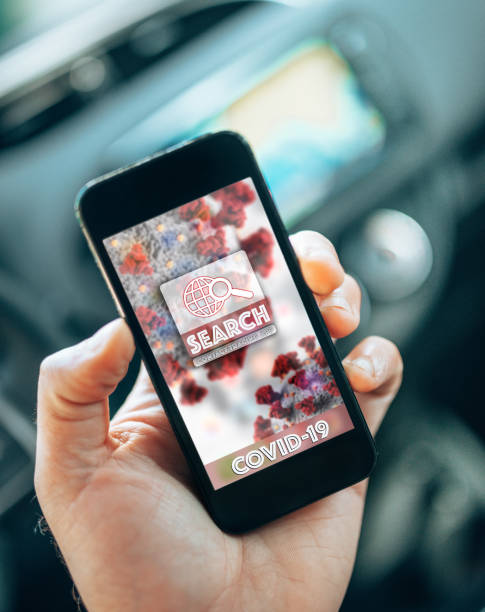 istock man in the car using the contact tracing app 1227321651