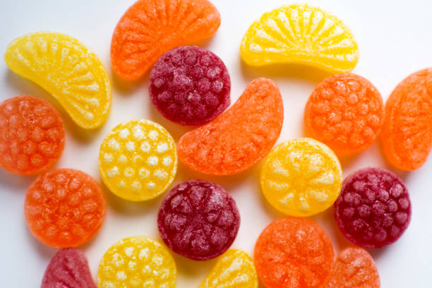 istock little fruit colored sweet lollipops isolated on white background 1227321659