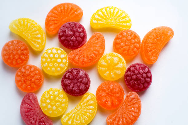 istock little fruit colored sweet lollipops isolated on white background 1227321691