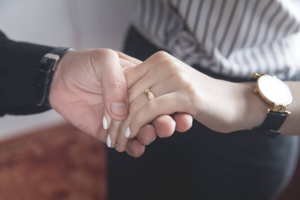 istock Hands of a guy and a girl with wedding ring. 1227321952