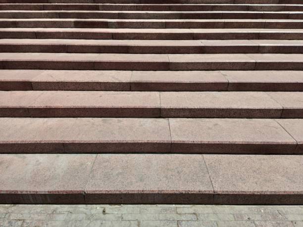 istock Stone staircase in an old park. Red granite steps 1227322226