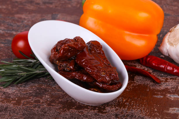 istock Dried tomatoes in the bowl with olive oil 1227322754