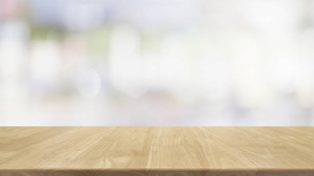 istock Empty wood table top and blur glass window interior restaurant banner mock up abstract background - can used for display or montage your products. 1227323848