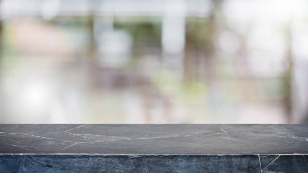 istock Empty black marble stone table top and blur glass window interior restaurant banner mock up abstract background - can used for display or montage your products. 1227323891
