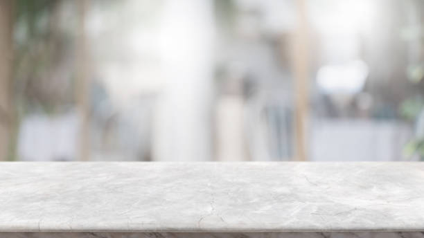 istock Empty white marble stone table top and blur glass window interior lobby and hall way banner mock up abstract background - can used for display or montage your products. 1227323895