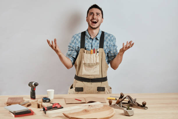 istock Cheerful pleasant bearded joiner is resting at work 1227325351