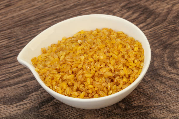 istock Vegetarian cuisine - dry bulgur for cooking 1227326860